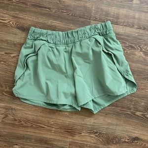 Ivivva green athletic shorts size 12.